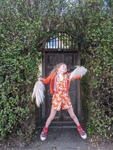 Load image into Gallery viewer, Star jumping Girl in Orange Daisy Vintage Retro 60s Style Playsuit Children's 2nd Hand Clothes Sale
